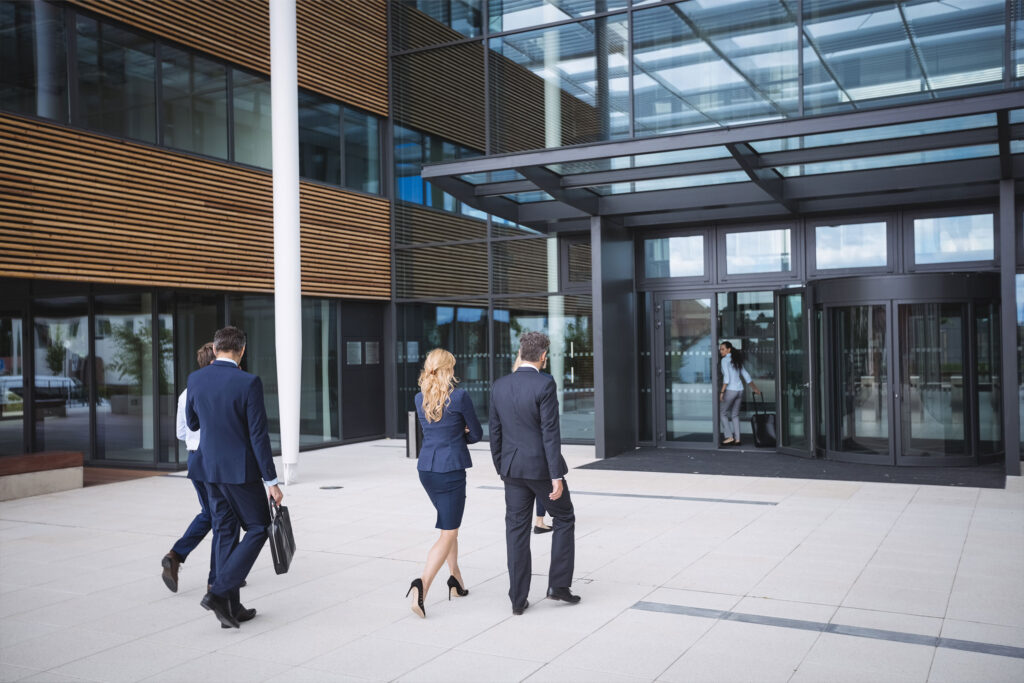 business-people-entering-office-building