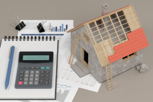 House, calculator and documents. Construction budget concept