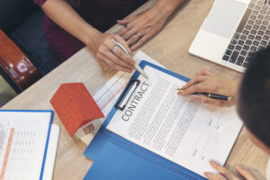 Close up Team Businesswoman hands partners sign contract with success business deal. Diversity Businesswoman teams handshake together. Partnership teamwork meeting signing contract business concept